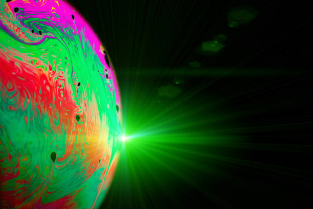 istock Colorful bubbles. Globe planet earth in galaxy universe space with abstract sun on black background. Astronomical scientific concept. 1321229970