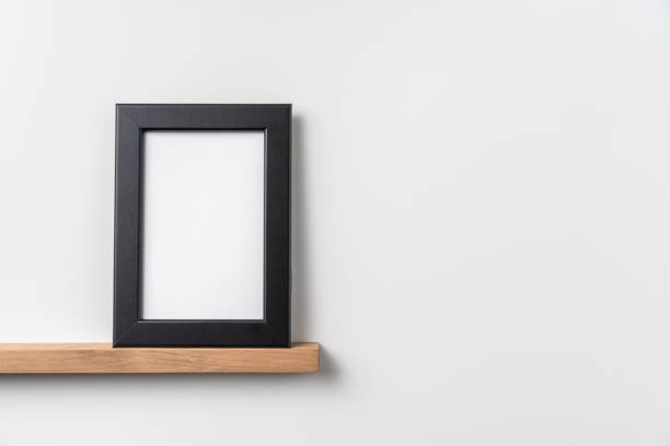 istock vertical black wood photo on bookshelf 1321231015