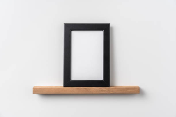 istock vertical black wood photo on bookshelf 1321231026