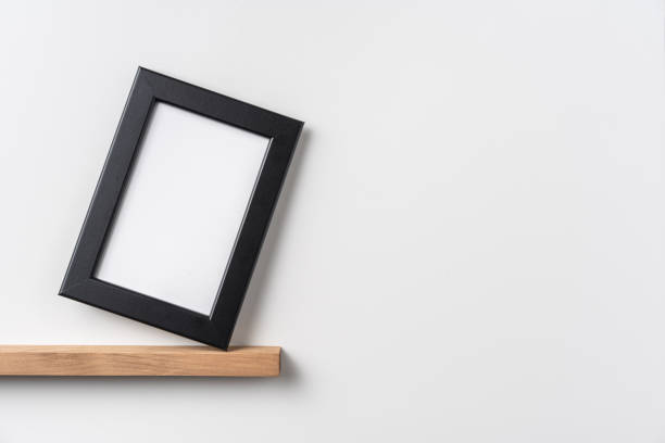 istock vertical black wood photo on bookshelf 1321231622