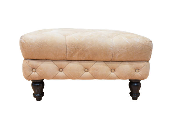 istock Leather padded stool with wooden legs isolated on white background 1321235321