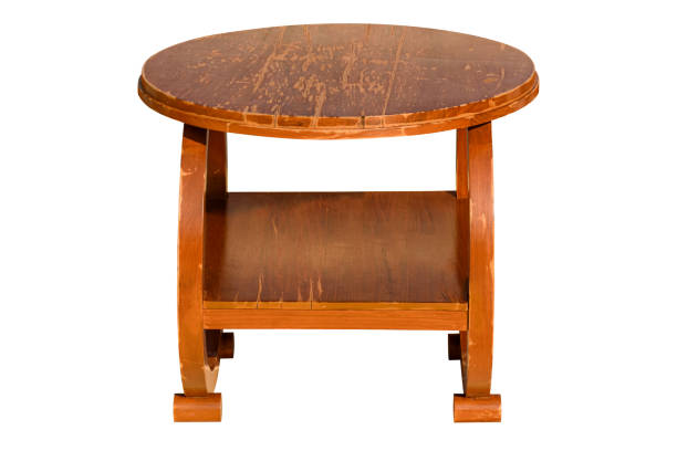 istock Old round wooden table isolated on white backgrounds 1321235437