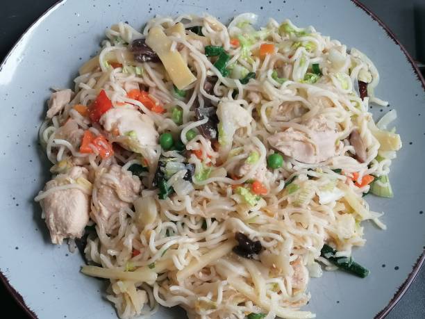 istock Fried noodles with chicken and chinese vegetables 1321237056