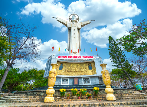 Vung Tau, Vietnam - February 25th, 2021: Statue of Jesus Christ standing on Mount Nho attracts pilgrims to visit and worship, the most popular local place in Vung Tau, Vietnam