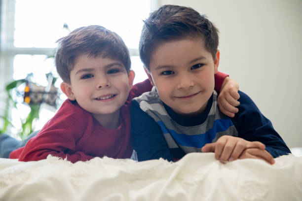 Portrait of two young brothers smiling.
