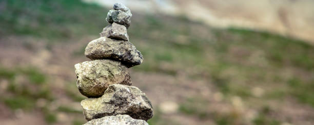 istock Balanced Zen stones on nature mountains background. 1321241832