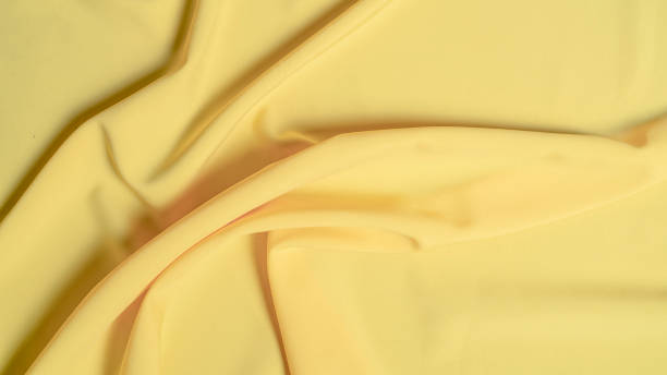 istock Gold silk fabric background - soft, elegant and delicate 1321242471