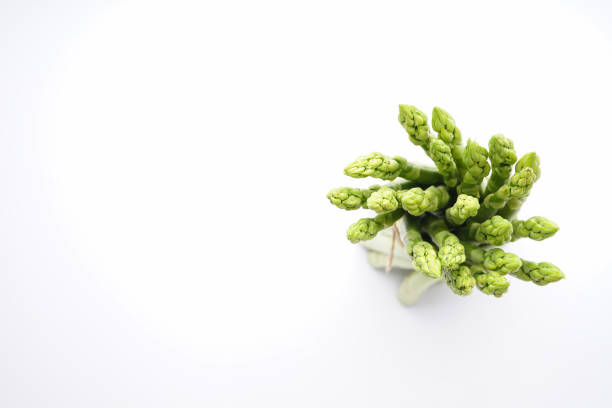 istock Fresh green asparagus on white background, top view with place for text 1321242826