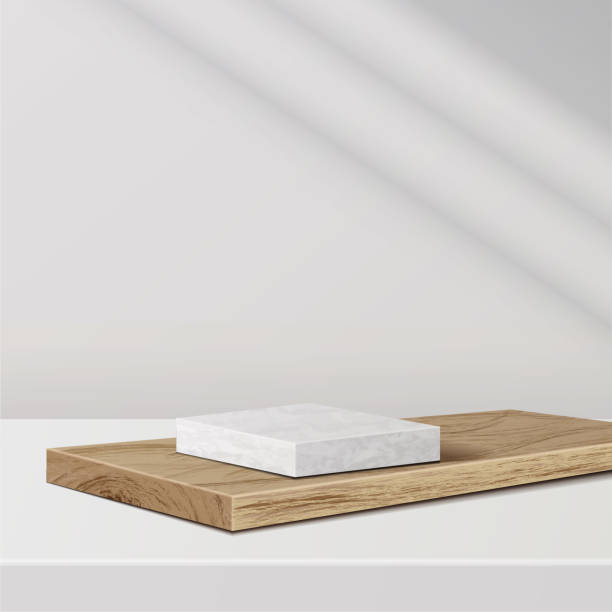 istock minimal scene with geometric forms. marble podium on wood podium with sun light on white background. 1321252854