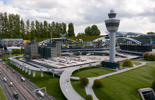The Hague, Netherlands - 20th May, 2017: Miniature representation of the car park and terminal building of the Amsterdam Airport Schiphol at Madurodam in The Hague, Netherlands. Selective focus.