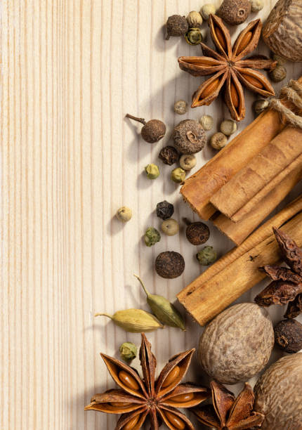 istock Still life with dried spices on a light wooden background. 1321255042