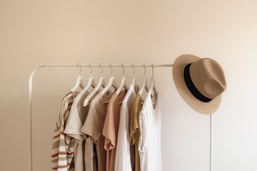 Rack with stylish women's summer clothes. Concept for shopping store, beauty, fashion.