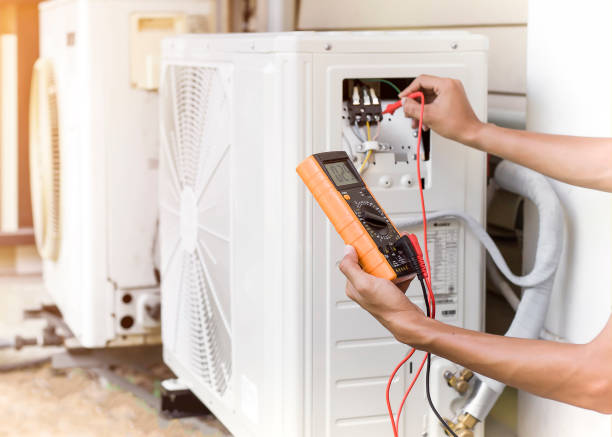 istock Air conditioner repairman using electricity meter to check air conditioner operation, maintenance concept 1321257251