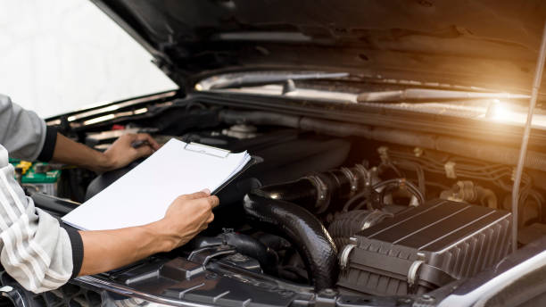 istock A technician is checking the car battery for availability.; 1321257316