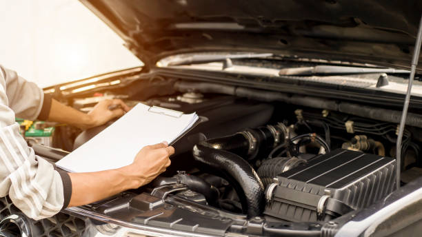 istock A technician is checking the car battery for availability.; 1321257358