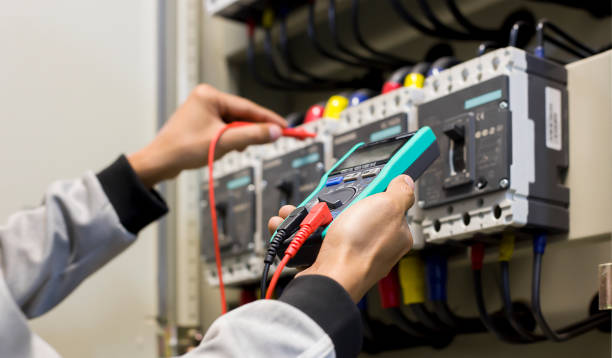 istock Electrical engineer tests the operation of the electric control cabinet on a regular basis for maintenance. 1321257385