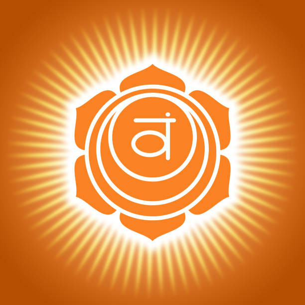 チャクラ・スワドヒスタナオレンジ色の輝くヨガのシンボル。オムサイン。仙骨アイコン - om symbol 写真 ストックフォトと画像