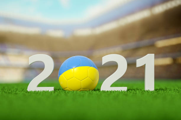 istock 2021, Ukraine Soccer Ball on a grass field 1321258244