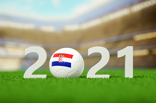 3d rendering of soccer ball with national flag on a grass field.