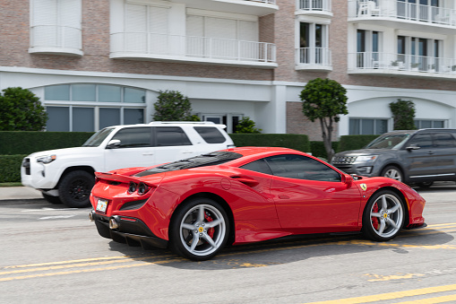 Palm Beach, Florida USA - March 21, 2021: red Ferrari SF90 Stradale luxury car parked in palm beach, united states of america. side view. Ferrari is luxury car brand
