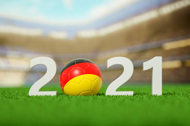 istock 2021, German Soccer Ball on a grass field 1321258590