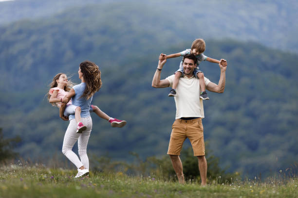 istock Young carefree family having fun during springtime in nature. 1321259488