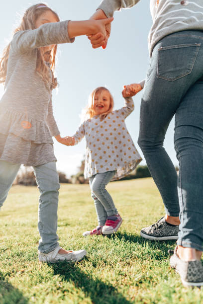 istock mother holding hands with the daughter 1321261817