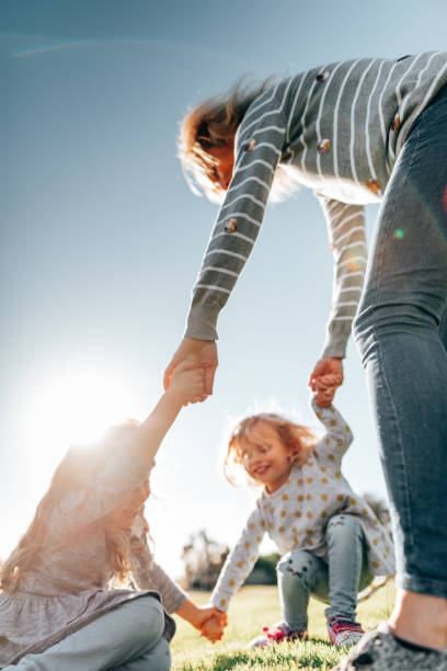 istock mother holding hands with the daughter 1321262234