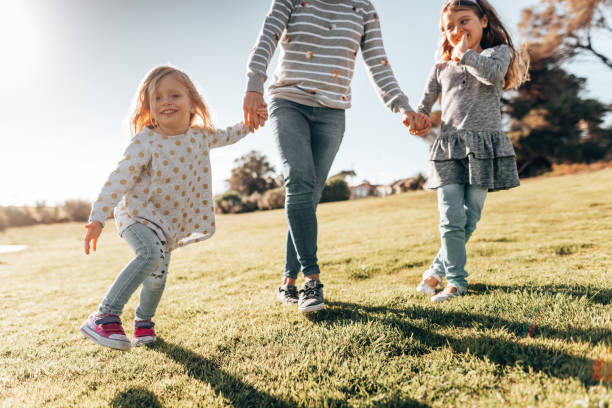 istock mother holding hands with the daughter 1321262789