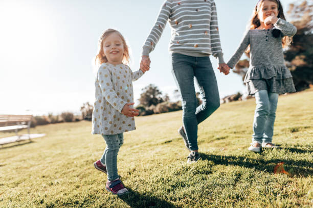 istock mother holding hands with the daughter 1321262929