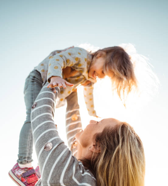 istock holding the daughter in the sky 1321263014