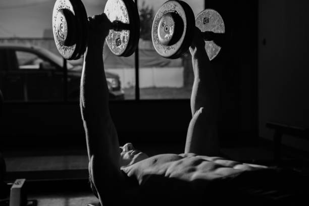 istock Muscular Man Working Out In Gym 1321263429