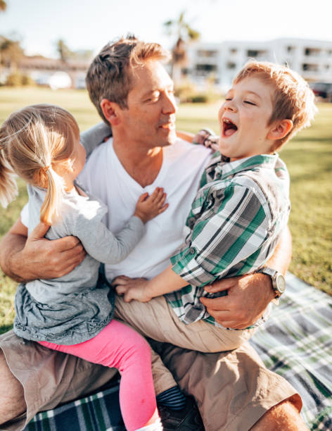 istock father playing with sons in the courtyard 1321263448