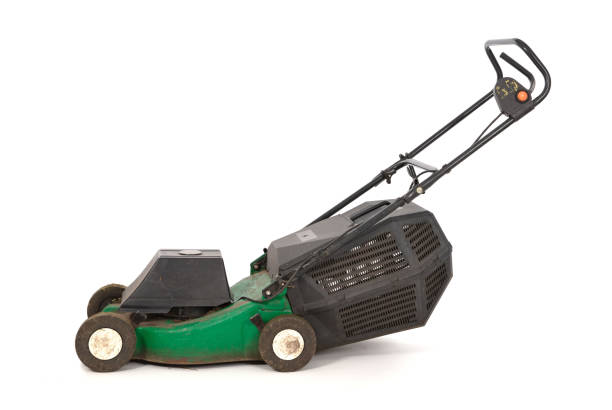 Old green lawn mower - Isolated on white background stock photo