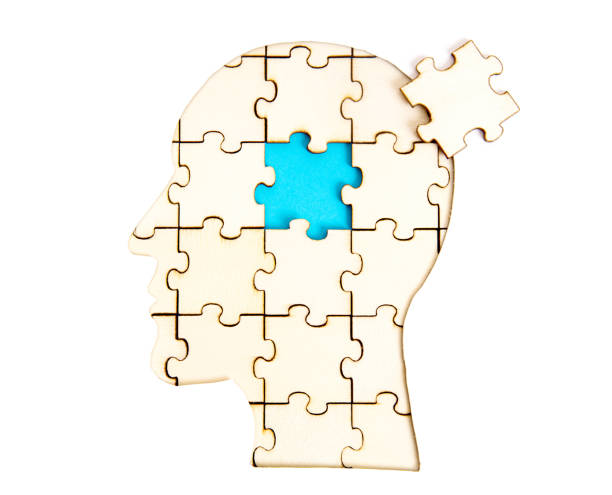 istock Human head shaped jigsaw puzzle with the final piece isolated on white 1321264928