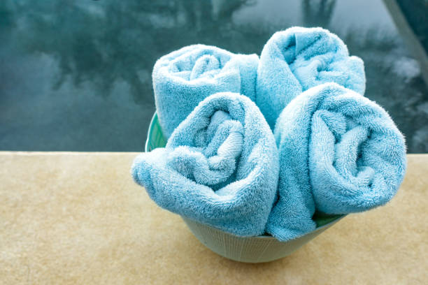 istock Soft towels in a basket by the pool 1321264973