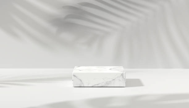 istock Marbel podium  for product showcase. White marble product display. Natural light copy space. Minimal abstract cosmetic background for product presentation. 1321265722