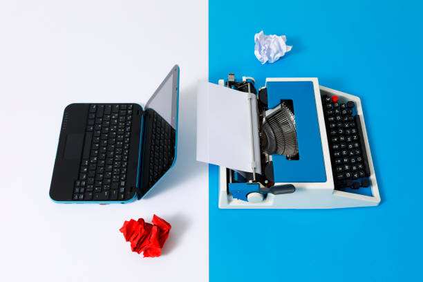 istock Digital und analog – Laptop and 80s Typewriter 1321266459