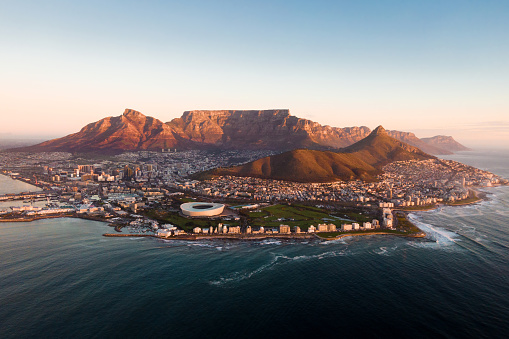 Aerial view of Cape Town cityscape at sunset, Western Cape Province, South Africa.