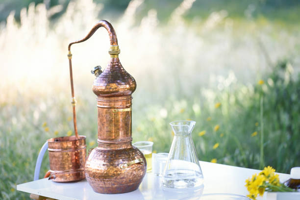 istock Tabletop alembic still in the forest to extract essential oils 1321268418