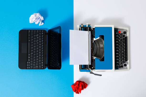 istock Digital und analog – Laptop and 80s Typewriter 1321269857