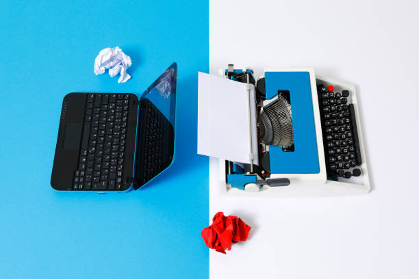 istock Digital und analog – Laptop and 80s Typewriter 1321270941