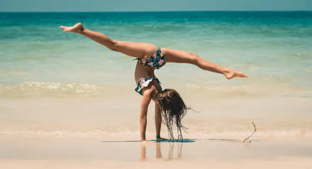 Photo of Little Girl Athlete on the Beach