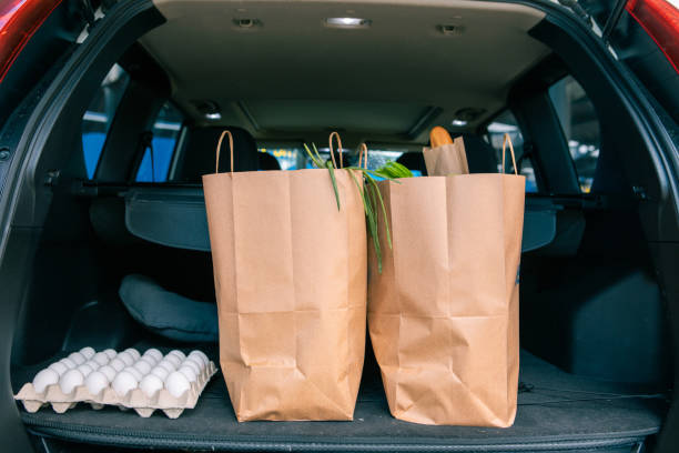 istock bags with products in car trunk 1321274310