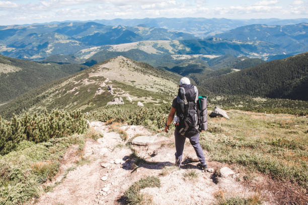 istock young hiker man in mountains. summer trekking path 1321274361
