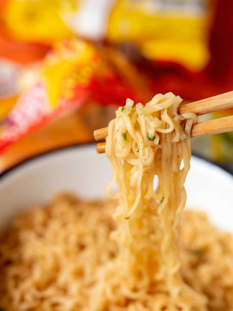 istock Hot, ready to eat, Asian instant noodles on chopsticks. 1321275903