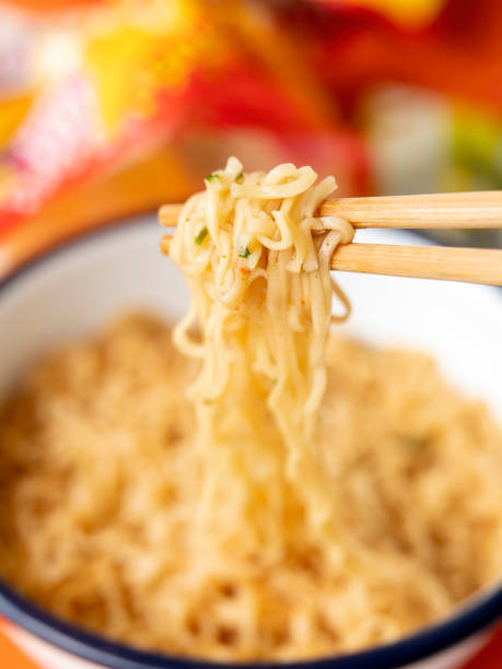 istock Hot, ready to eat, Asian instant noodles on chopsticks. 1321275907