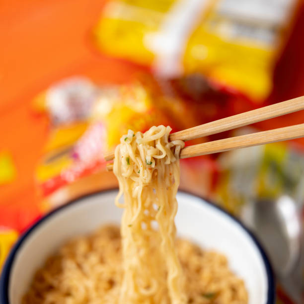 istock Hot, ready to eat, Asian instant noodles on chopsticks. 1321275917