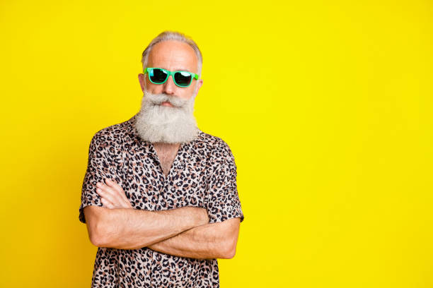 istock Portrait of attractive content grey-haired man folded arms copy space isolated over bright yellow color background 1321279205