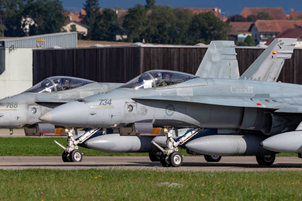 two royal canadian air force mcdonnell douglas cf-188a aircraft at payerne airport. - military airplane mcdonnell douglas fa 18 hornet military fighter plane imagens e fotografias de stock